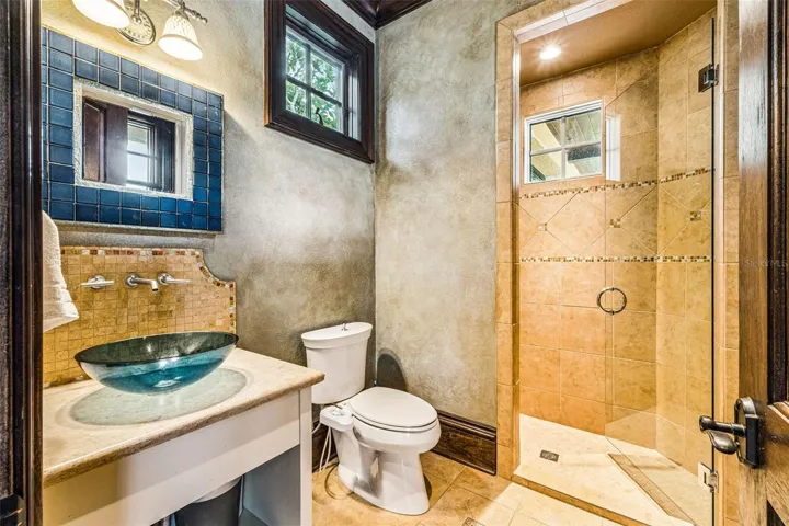 Bathroom with easy access to pool area.
