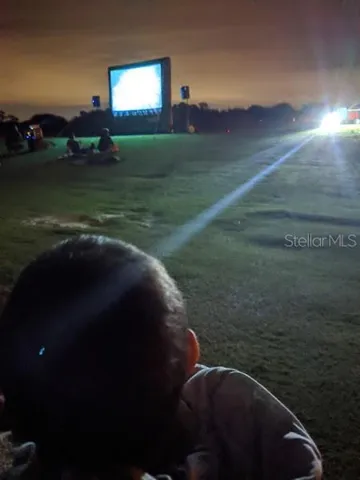 Outdoor movie nights on the fairway create a unique community atmosphere residents love.