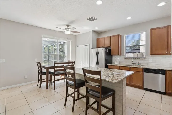 Additional dining space overlooking the backyard and pool area.