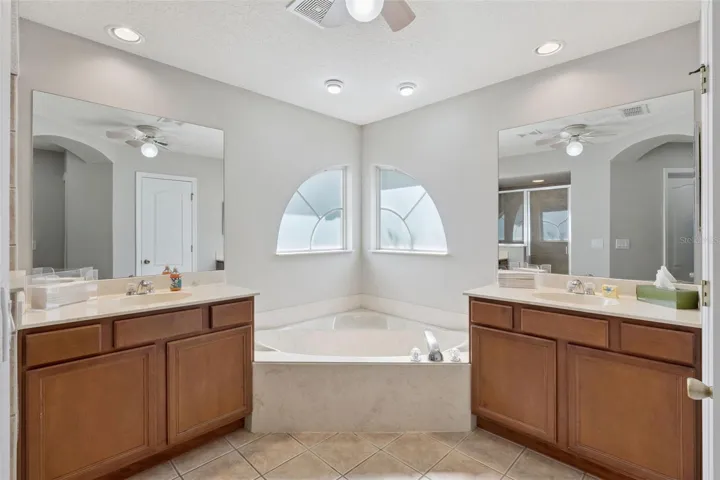 Well-appointed primary bath designed for both comfort and functionality.