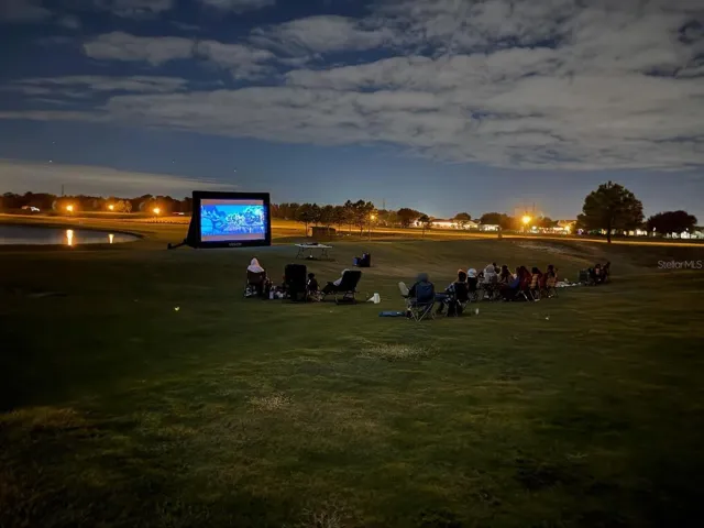 Outdoor movie nights on the fairway create a unique community atmosphere residents love.