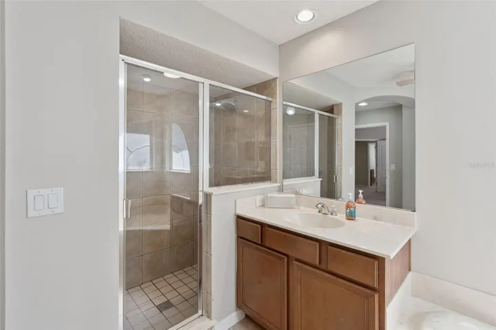 Well-appointed primary bath designed for both comfort and functionality.