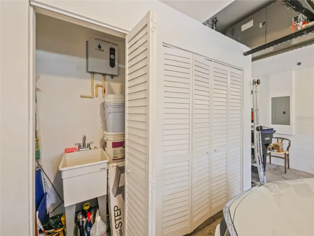 Garage with storage closet and wash sink
