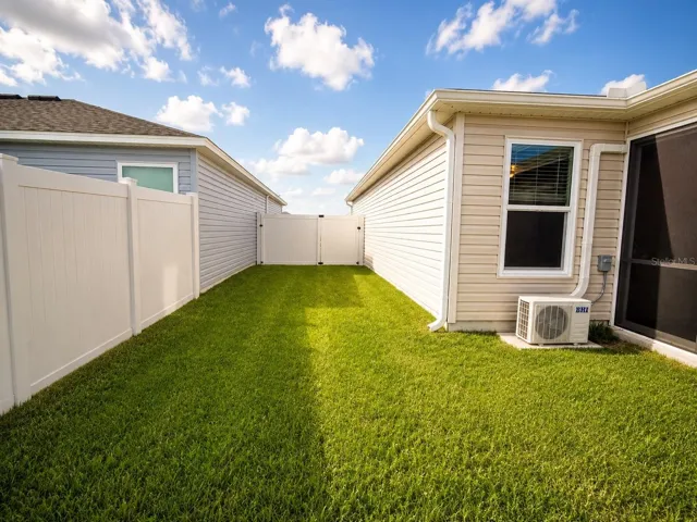 Left side of house, fenced in