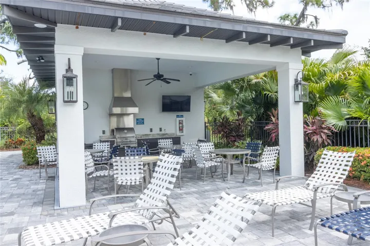Oasis pool has a BBQ kitchen and dining area for afternoon of relaxing