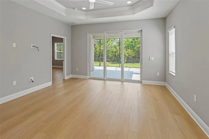 Great room has lots of light and wooded view