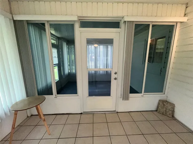 Door to enclosed area leading to patio