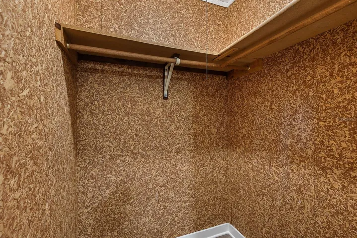 Primary bedroom walk-in closet