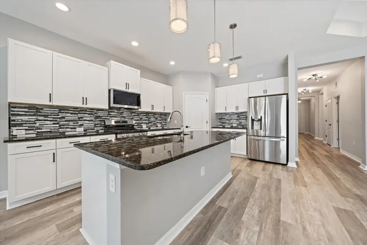 KITCHEN - new appliances, deep walk-in pantry, tile backsplash, GASH stove