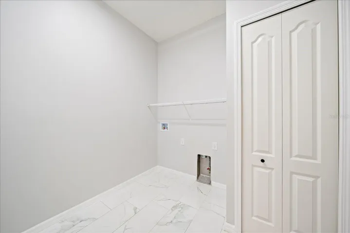 LAUNDRY ROOM with closet, gas operated dryer