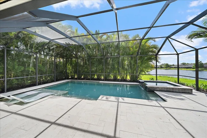 Travertine decking really elevates the quality of this residence.