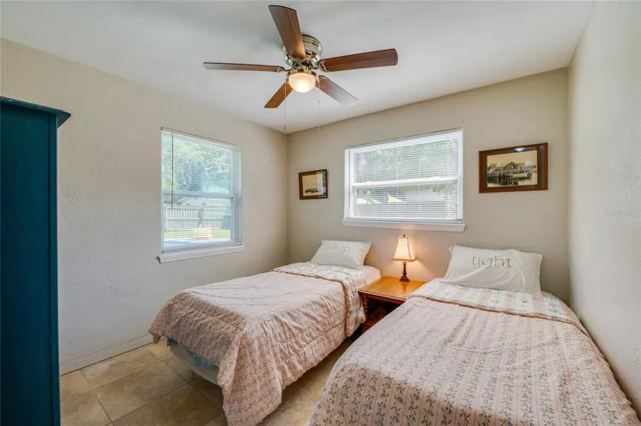 Bright bedroom with dual windows offering a bright and airy feel.