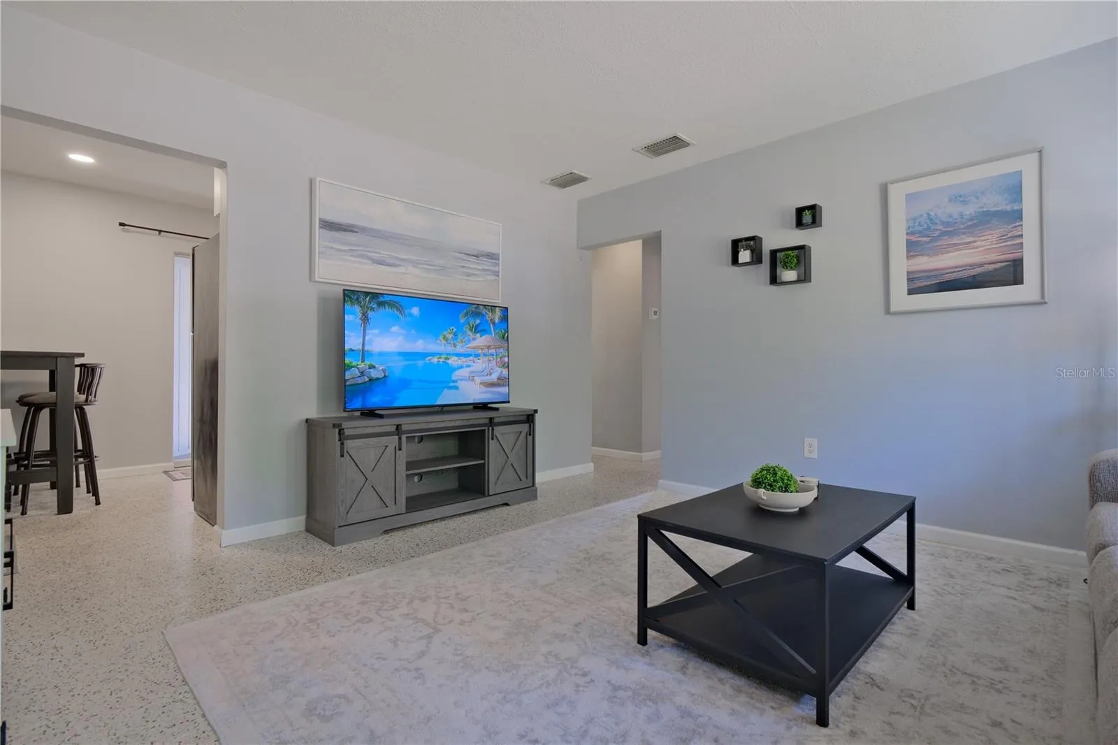 Unit B Living Room facing Kitchen & Hallway