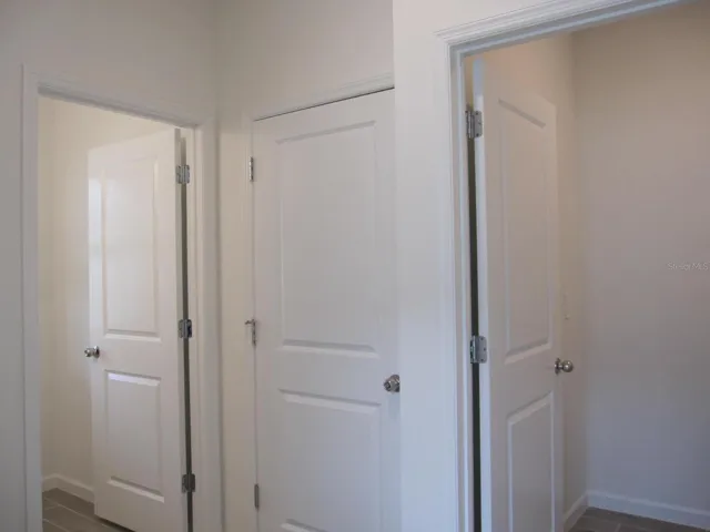Half bathroom, garage entrance, and laundry room