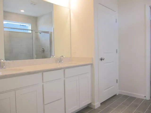 Primary bathroom dual vanity sink area