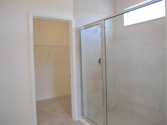 Primary bedroom shower & walk-in closet
