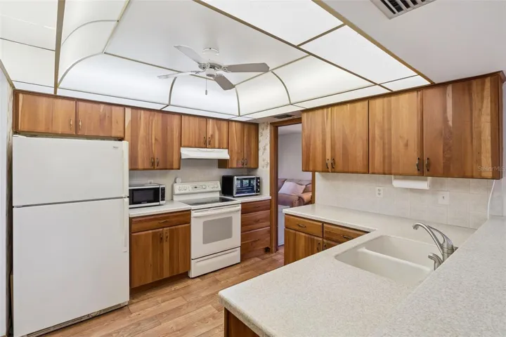 Bright Kitchen with sliders from the breakfast noon to the back yard