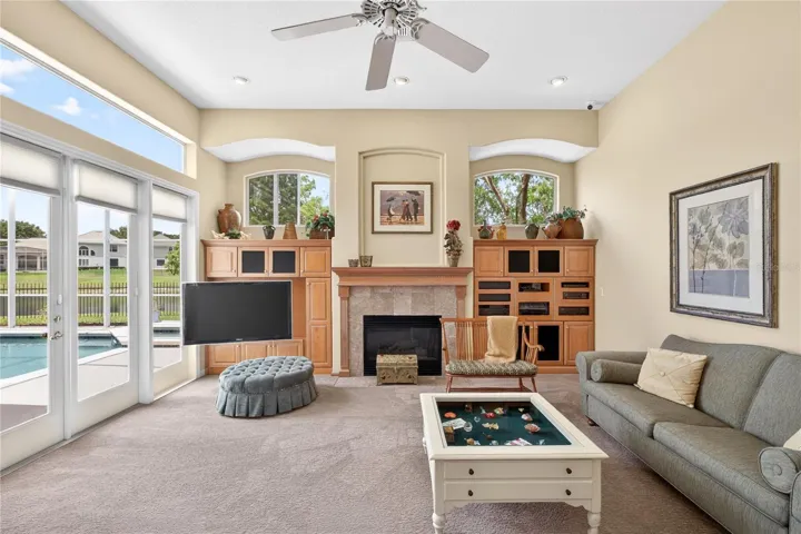 The view from the family room looks out to the pool and the pond at the rear of the property.
