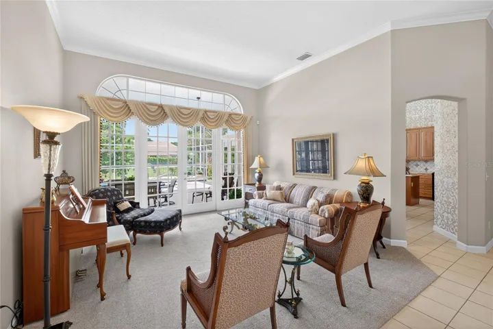 Living room overlooks the screened pool and lanai.