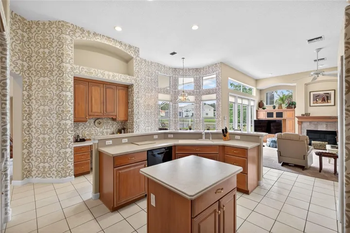 A planning desk is conveniently located in the kitchen adjacent to the casual dining area.