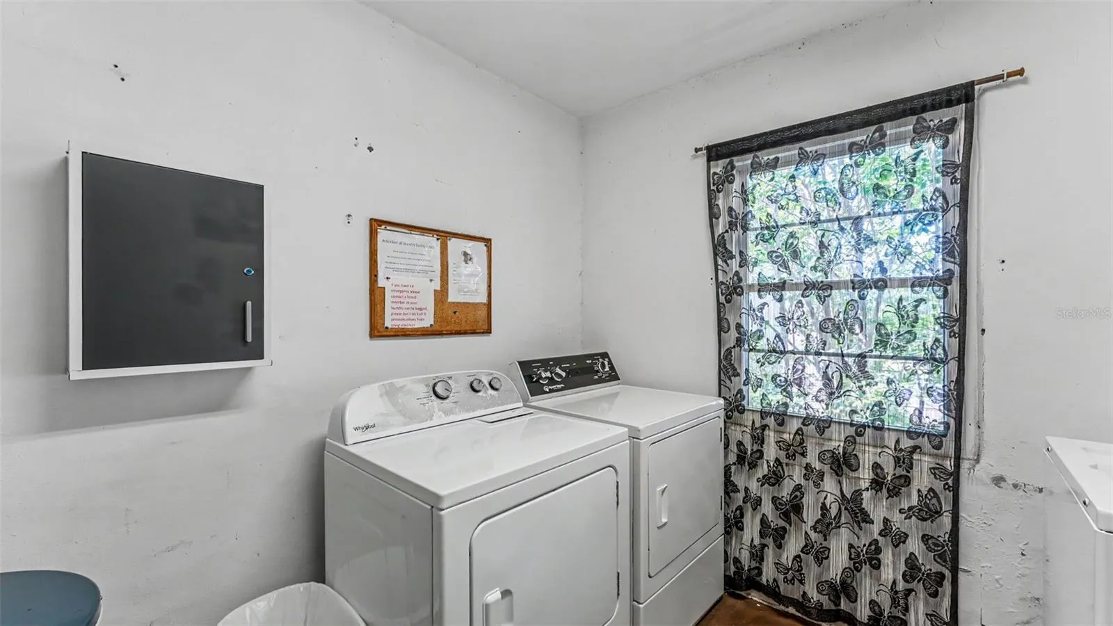 laundry room, just steps outside your door down the hall