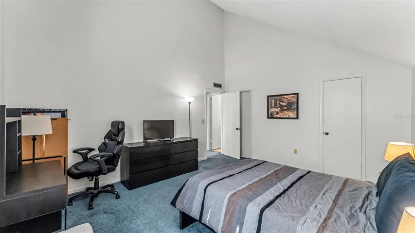 spacious bedroom suite with vaulted ceilings