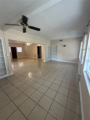 Bonus room family room leading to screened patio