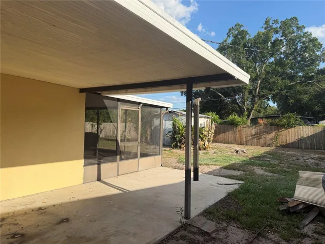 Back yard covered area and screened patio