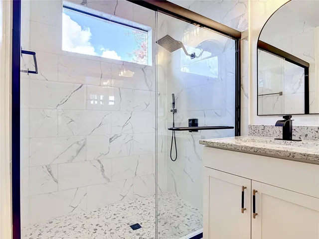 Primary Bathroom has gorgeous tile and finishes.