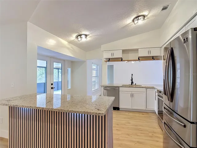 Modern peninsula in Kitchen, room for seating and enhanced with lighting underneath.