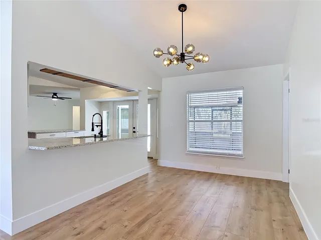 Dining Room showing counter height bar seating area.