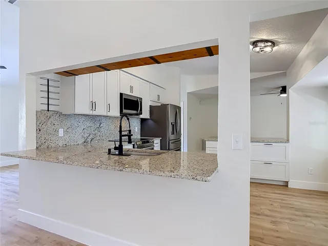 Another view of the Kitchen and counter seating.
