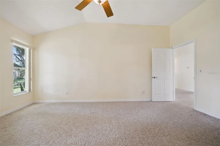 Primary bedroom with ensuite bath and walk-in closet