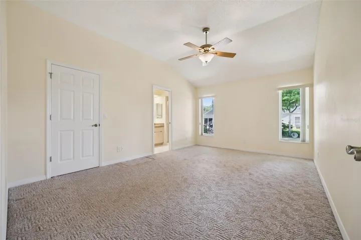 Primary bedroom with ensuite bath and walk-in closet