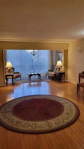 Living dining area, staged with owners previous furniture, no longer there.