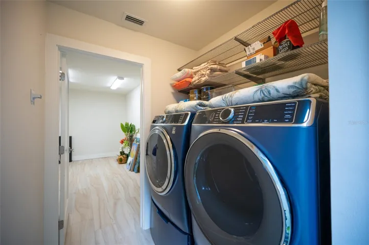 The laundry room is located in the Casita and also features a large storage room.  Both rooms are air conditioned.  The storage room would also be a great flex space and perfect for a game room.
