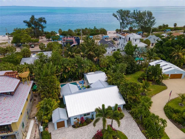 Aerial view of the property which also shows the parcel at 240 Gladiolus available for separate purchase which has 10,600+ squ ft of land and a large garage.