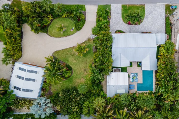 Aerial view showing 242 Gladiolus and the adjacent parcel at 240 Gladiolus which is beautifully landscaped and has a large garage.  240 Gladiolus is also available and offered as a separate purchase.