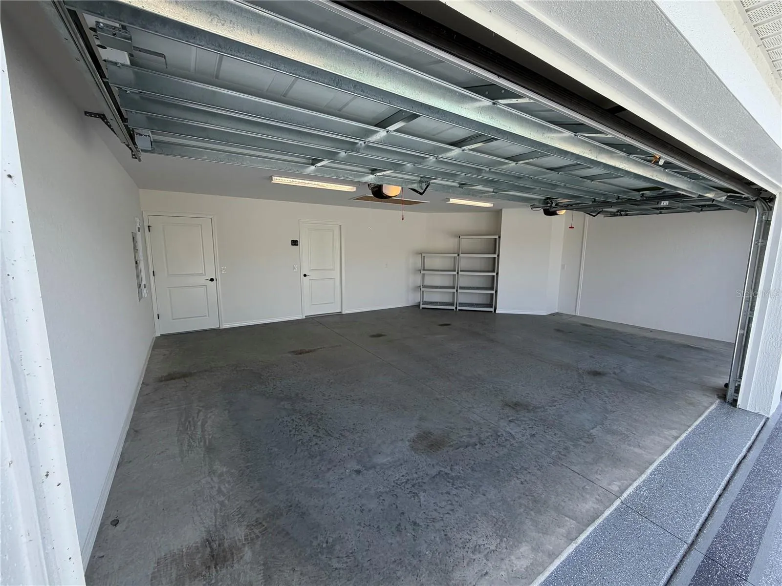 2 outside garage looking toward entry into house