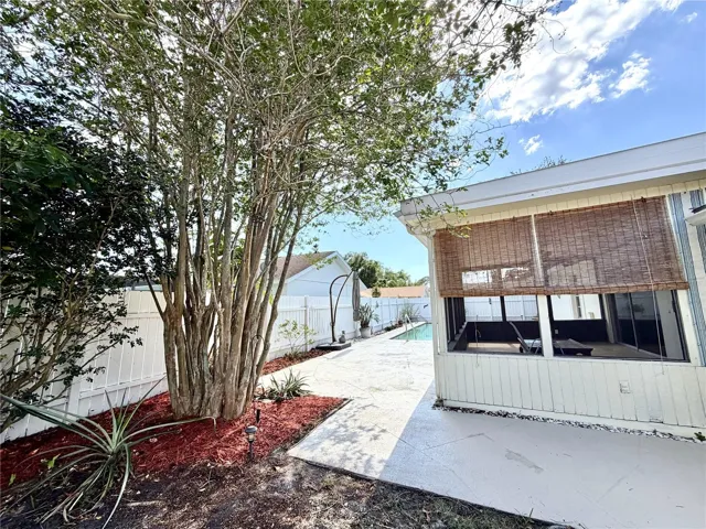 Screened Patio overlooks pool area
