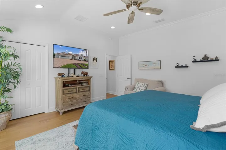 Second bedroom angle with built-in closet & newer ceiling fan