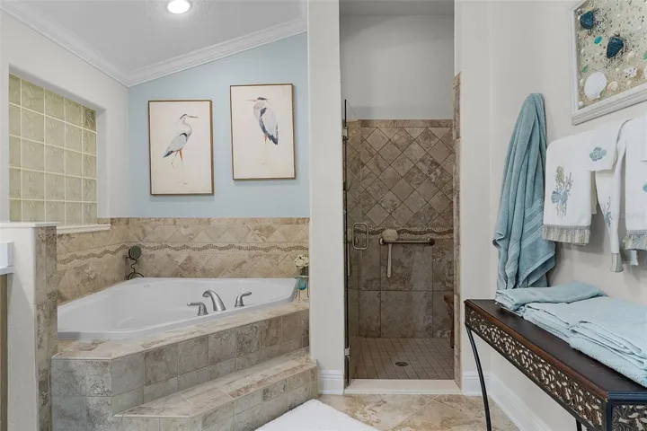 Garden tub & tiled walk-in shower with frameless glass doors
