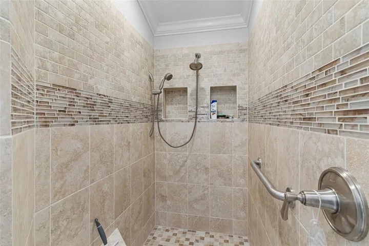 This newer bath also features a tiled Roman Shower