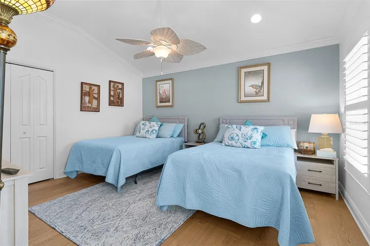 Front bedroom in the added on space to the east side of the home. Includes an updated fan & a built-in closet.