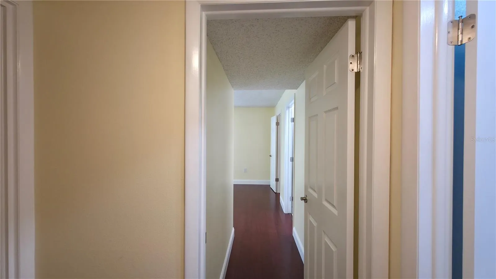 Hallway to primary bedroom