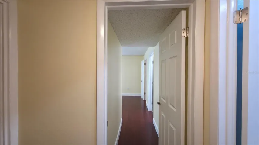 Hallway to primary bedroom