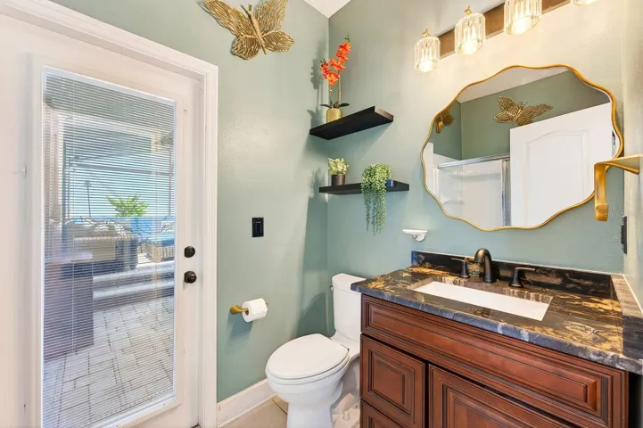 Main floor full/en-suite pool bath.