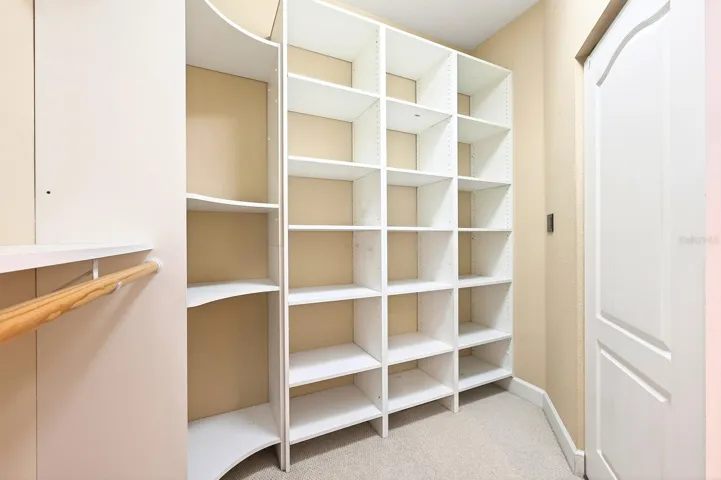 Primary suite custom walk-in closet.