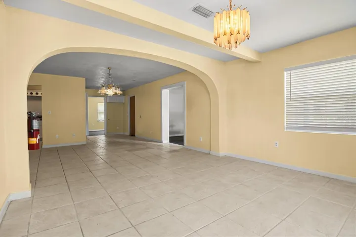 View of the living room and dining room from the front door.