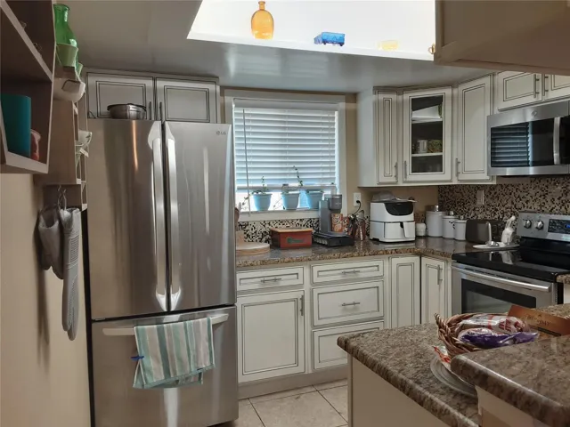 Kitchen with stainless steel appliances.